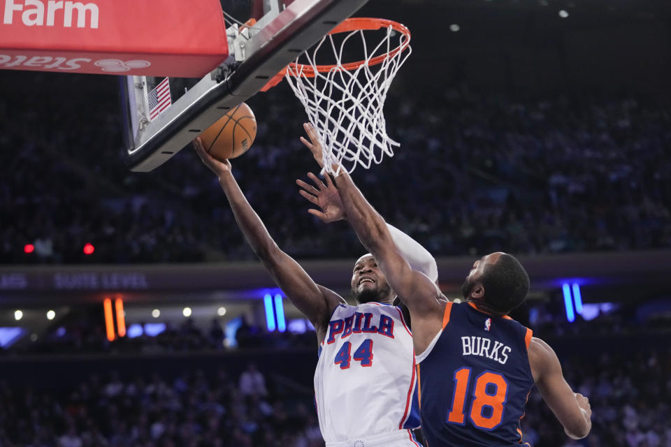 Philadelphia 76ers forward Paul Reed (44) goes to the basket against New York Knicks guard Alec Burks (18) during the first half of an NBA basketball game Tuesday, March 12, 2024, at Madison Square Garden in New York. (AP Photo/Mary Altaffer)