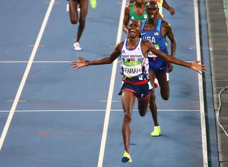 2016 Rio Olympics - Athletics - Final - Men's 5000m Final - Olympic Stadium - Rio de Janeiro, Brazil - 20/08/2016. Mo Farah (GBR) of Britain celebrates as the wins the race REUTERS/David Gray