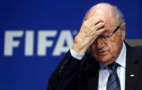 Re-elected FIFA President Sepp Blatter gestures during news conference after an extraordinary Executive Committee meeting in Zurich, Switzerland, in this May 30, 2015 file photo. REUTERS/Arnd Wiegmann/Files