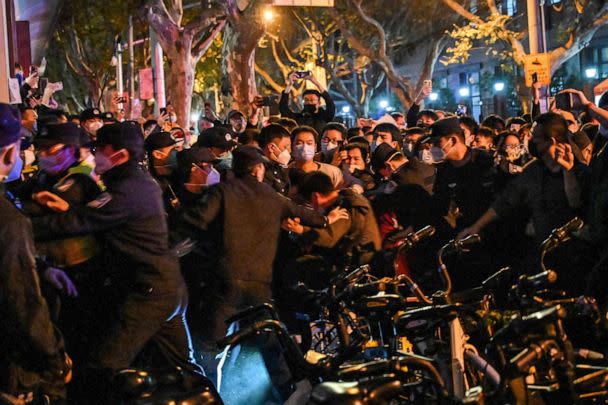 PHOTO: Police arrest a man during protests, Nov. 27, 2022, in Shanghai.  (Hector Retamal/AFP via Getty Images)