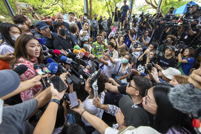 Paetongtarn Shinawatra, left, one of the prime minister candidates from Pheu Thai Party, speaks to media after she cast her vote at a polling station in Bangkok, Thailand, Sunday, May 14, 2023. Voters in Thailand were heading to the polls on Sunday in an election touted as a pivotal chance for change, eight years after incumbent Prime Minister Prayuth Chan-ocha first came to power in a 2014 coup. (AP Photo/Wason Wanichakorn)