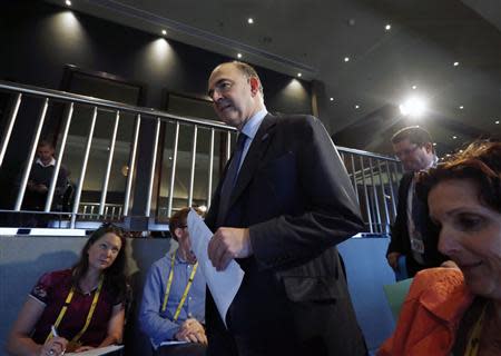 French Economic Minister Pierre Moscovici arrives at a news conference at the G20 Central Bank Governors and Finance Ministers annual meeting in Sydney, February 23, 2014. REUTERS/Jason Reed