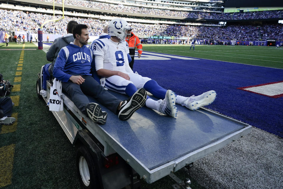 Indianapolis Colts' Nick Foles is carted off the field following an injury in the first half of an NFL football game against the New York Giants, Sunday, Jan. 1, 2023, in East Rutherford, N.J. (AP Photo/Bryan Woolston)