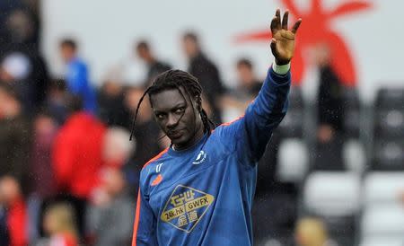 Swansea's Bafetimbi Gomis waves to fans after the game Reuters / Rebecca Naden Livepic