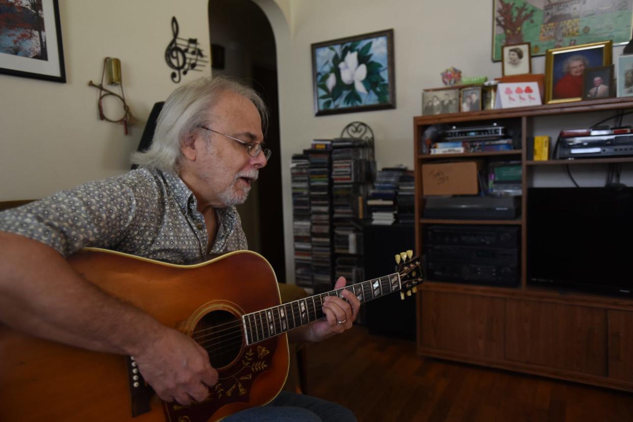 Singer-songwriter Tom Heideman plays the title track of his newly-released EP "Find a Better Way," Monday, Aug. 7, 2023, at his home in Lansing. Heideman's song addresses the pervasiveness of gun violence in today's society. The five-song EP and title track is available at iTunes.