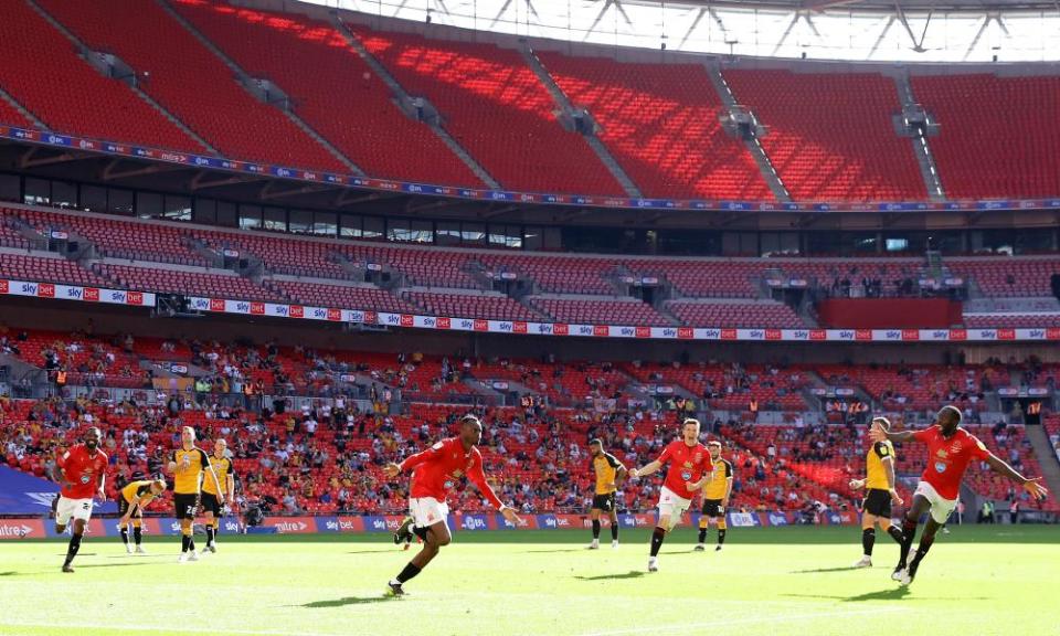 Carlos Mendes Gomes celebrates after scoring from the penalty spot.