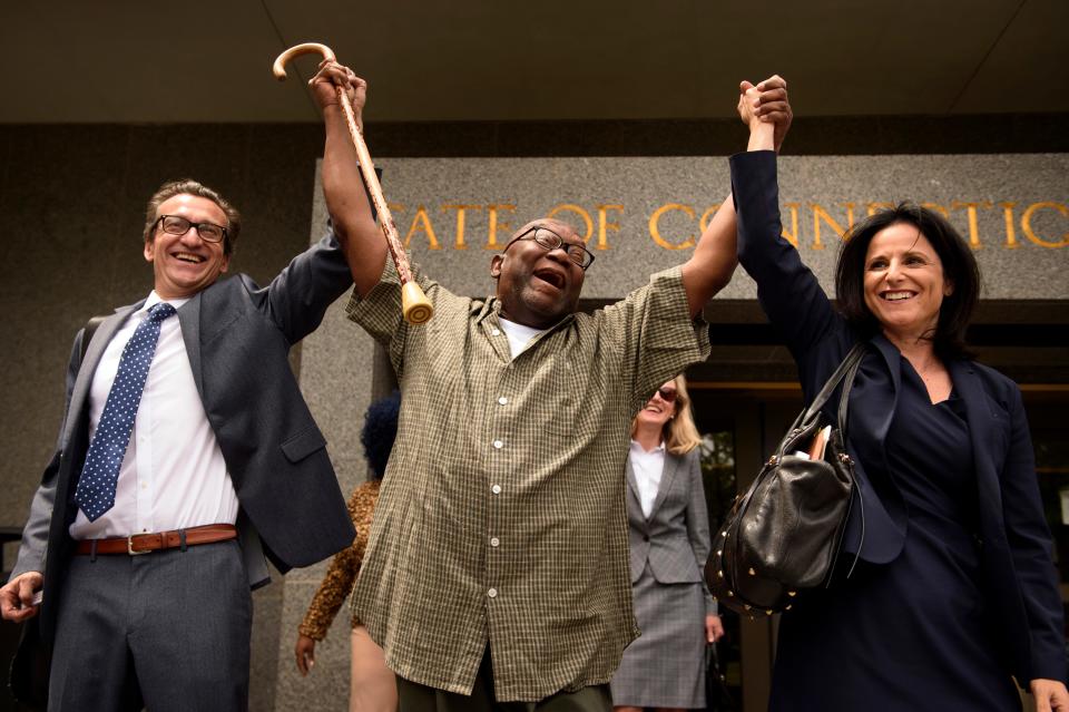 Alfred Swinton, middle, walks out of Connecticut Supreme Court in June 2017 with Innocence Project lawyers Chris Fabricant, left, and Vanessa Potkin after a Superior Court judge approved a new trial in his conviction in the 1991 murder of Carla Terry. After serving 18 years, Swinton, 68, was released on a promise to appear in court.