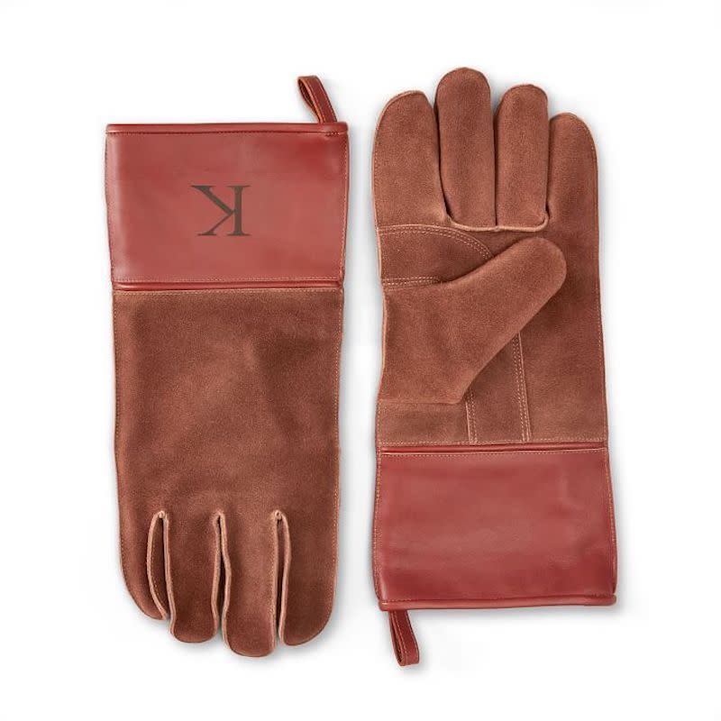 <p><a href="https://go.redirectingat.com?id=74968X1596630&url=https%3A%2F%2Fwww.markandgraham.com%2Fproducts%2Fleather-and-suede-bbq-gloves%2F%3FcatalogId%3D32%26sku%3D5363487%26cm_ven%3DPLA%26cm_cat%3DGoogle%26cm_pla%3DHome%2B%253E%2BOutdoor%2BEntertaining%26region_id%3D669950%26cm_ite%3D5363487_17389899546_Pmax%26gclid%3DCjwKCAjw4c-ZBhAEEiwAZ105RVa5seHS0dFXicKbWkmfC1KhHaORM8zPsicnqC3y-9BeVAR37MR3rBoCmm8QAvD_BwE&sref=https%3A%2F%2Fwww.esquire.com%2Ffood-drink%2Fg41424520%2Fthe-26-best-grilling-gifts-for-the-bbq-master%2F" rel="nofollow noopener" target="_blank" data-ylk="slk:Shop Now;elm:context_link;itc:0;sec:content-canvas" class="link ">Shop Now</a></p><p>Leather and Suede BBQ Gloves</p><p>markandgraham.com</p><p>$47.99</p>