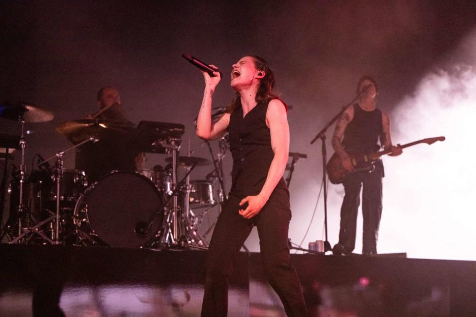 <p>Scott Dudelson/Getty</p> Christine and the Queens perform during Coachella in April 2023