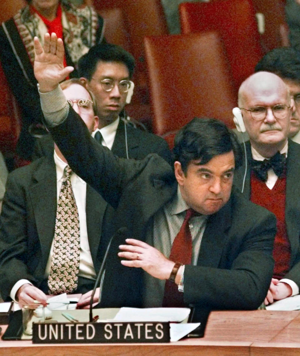FILE - Then U.S. Ambassador to the U.N. Bill Richardson votes to extend the UN's oil-for-food program, under which the Iraqis can sell limited amounts of oil to buy food and medicine, Dec. 4, 1997 at the United Nations in New York. (AP Photo/Kathy Willens, File)