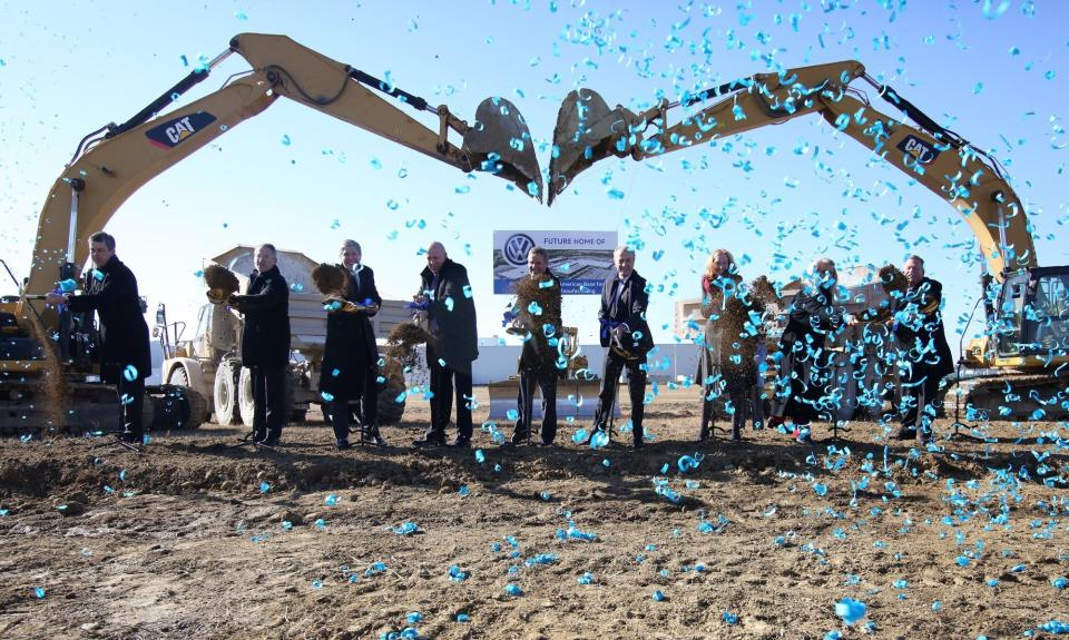 Tennessee officials, Chattanooga officials and Volkswagen officials pose for a photo during the groundbreaking event for the Volkswagen electric vehicle facility at the Volkswagen plant Wednesday, Nov. 13, 2019 in Chattanooga, Tenn. Volkswagen is making Tennessee its North American base for electric vehicle production, breaking ground on an $800 million expansion at the plant in Chattanooga. (Erin O. Smith/Chattanooga Times Free Press via AP)