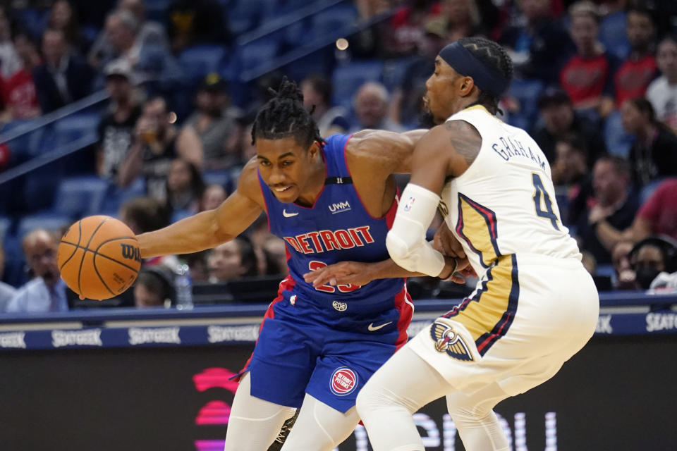 Detroit Pistons guard Jaden Ivey drives to the basket against New Orleans Pelicans guard Devonte' Graham (4) in the first half of an NBA preseason basketball game in New Orleans, Friday, Oct. 7, 2022. (AP Photo/Gerald Herbert)