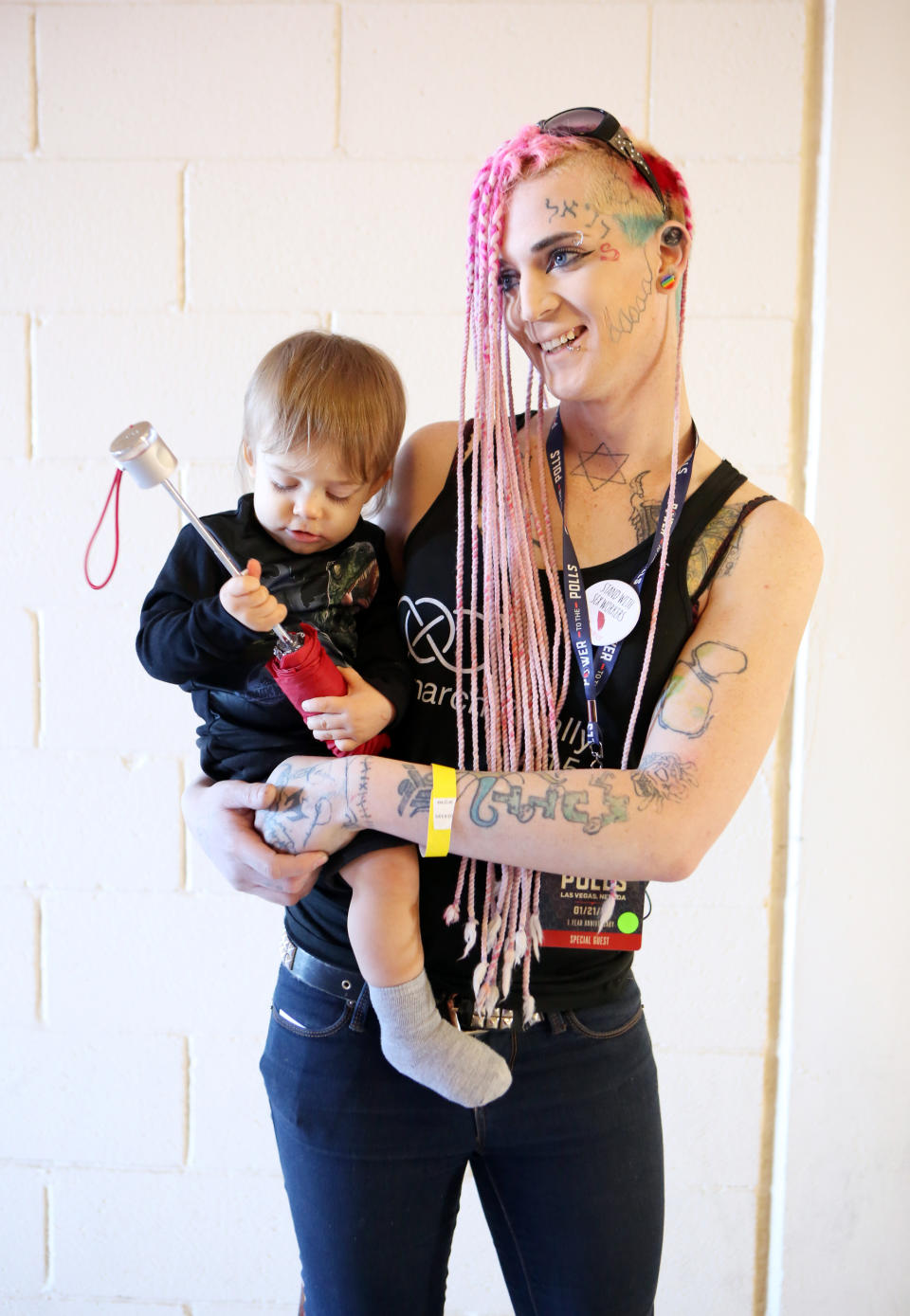 <p>Rebel, of Las Vegas, came out in support of sex workers’ rights. “Sex-worker rights are basic rights and human rights,” she said, holding her son. She’s been active in local efforts to protect and unionize prostitutes and says she’s created apps that can assess the safety of potential clients. (Photo: Ronda Churchill for Yahoo Lifestyle) </p>