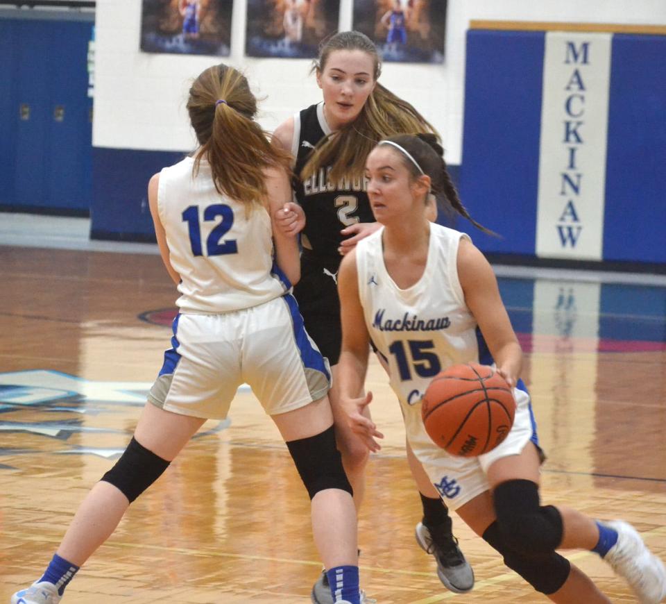 Mackinaw City junior guard Marlie Postula (15) drives to the basket during the first half against Ellsworth on Thursday. Postula scored a game-high 21 points in the Mackinaw City victory.