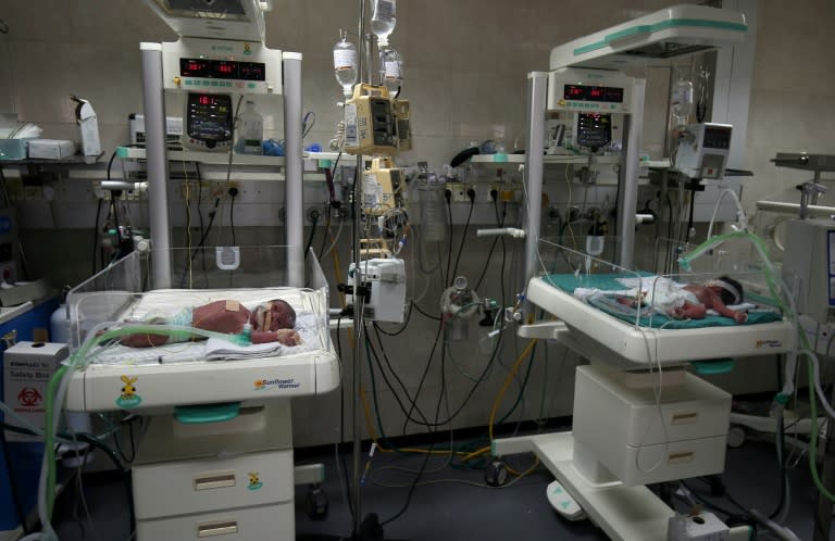 Newborns are seen inside incubators in the neonatal intensive care unit at the Al-Shifa hospital, which relies heavily on generators due to drastic power cuts in Gaza City