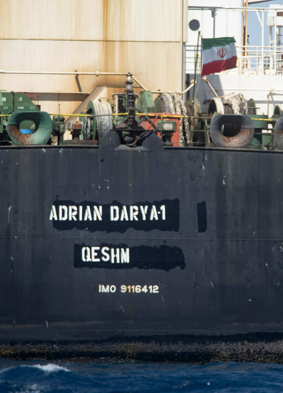 Renamed Adrian Aryra 1 super tanker hosting an Iranian flag, sails in the the waters of the British territory of Gibraltar, Sunday, Aug. 18, 2019. Authorities in Gibraltar on Sunday rejected the United States' latest request not to release a seized Iranian supertanker, clearing the way for the vessel to set sail after being detained last month for allegedly attempting to breach European Union sanctions on Syria. (AP Photo/Marcos Moreno)