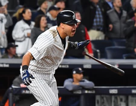 Oct 17, 2017; Bronx, NY, USA; New York Yankees designated hitter Gary Sanchez (24) hits a 2 RBI double against the Houston Astros during the eighth inning in game four of the 2017 ALCS playoff baseball series at Yankee Stadium. Mandatory Credit: Robert Deutsch-USA TODAY Sports