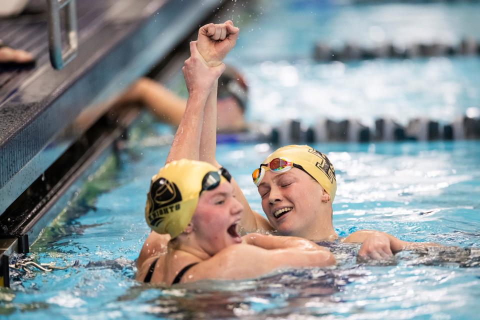 Teammates from Lone Peak High School celebrate after competing at the Utah 6A State Meet at the Stephen L. Richards Building in Provo on Saturday, Feb. 24, 2024. | Marielle Scott, Deseret News