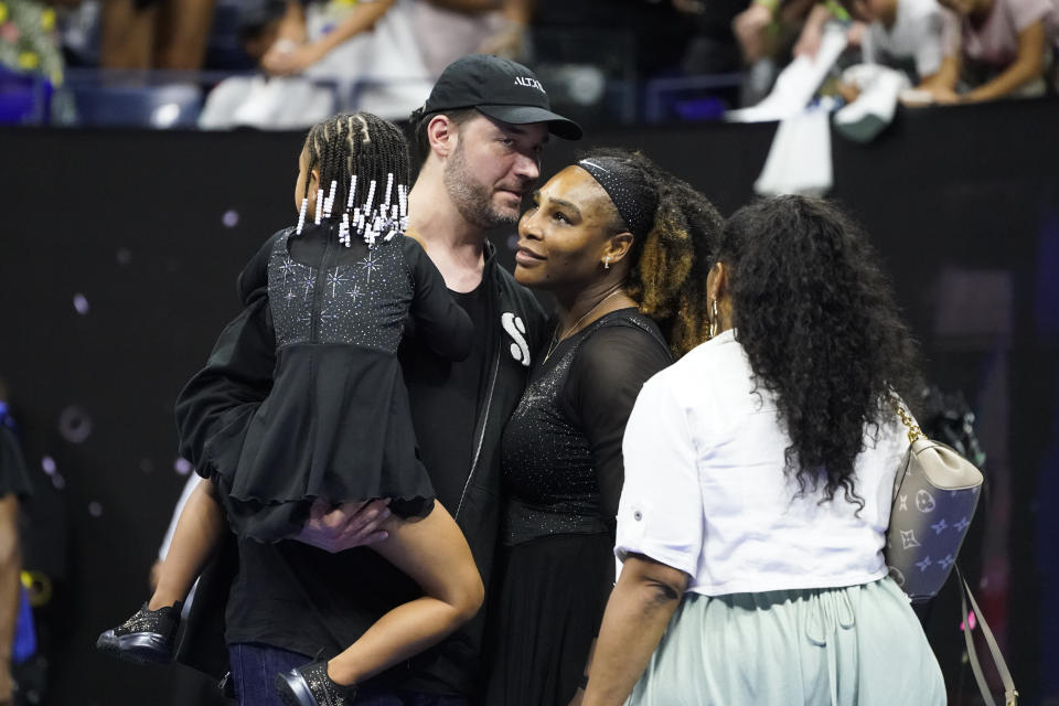 Serena Williams, of the United States, talks with her husband Alexis Ohanian and daughter Olympia after defeating Danka Kovinic, of Montenegro, during the first round of the US Open tennis championships, Monday, Aug. 29, 2022, in New York. (AP Photo/John Minchillo)