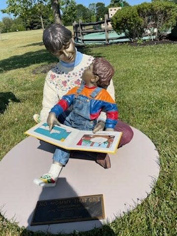 "No, Mommy, That One," captures the wonder of a child and mother sharing reading time. It's located in Lower Makefield's Memorial Park Secret Garden.