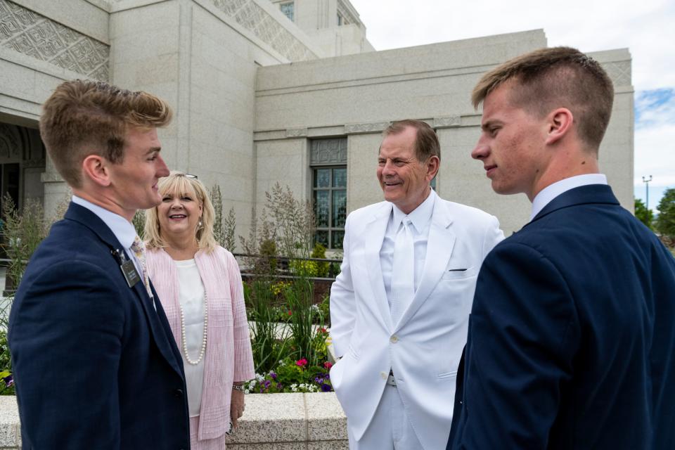 Elder Gary E. Stevenson of the Quorum of the Twelve Apostles and his wife, Sister Lesa Stevenson, talk with Elder Jared Cox, left, and Elder Cash Barker, right, between dedication sessions of the Helena Montana Temple on Sunday, June 18, 2023, in Helena, Montana. | Colter Peterson, Colter Peterson, for the Deseret News