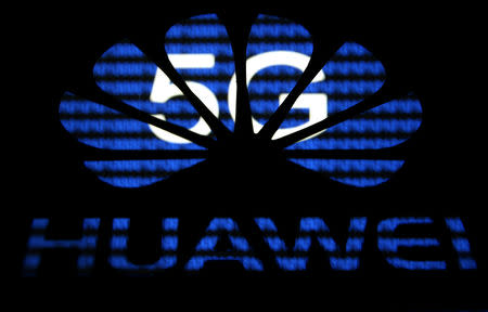 FILE PHOTO: A 3-D printed Huawei logo is seen in front of displayed 5G words in this illustration taken February 12, 2019. REUTERS/Dado Ruvic/File Photo