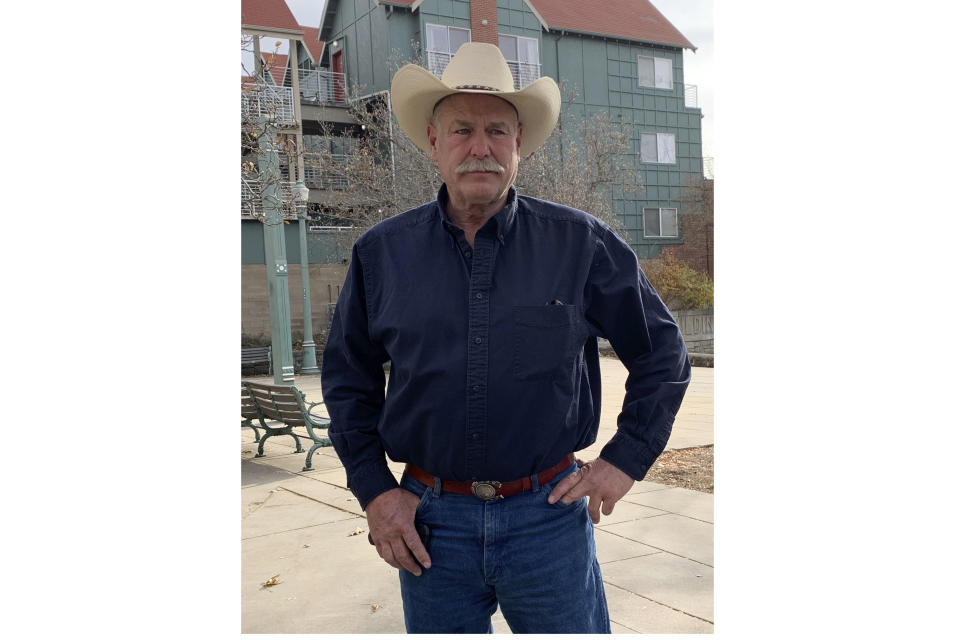 Brett Woolley is seen in Boise, Idaho, on Nov. 14, 2019. Forty years ago, Brett Woolley's father Dan Woolley was shot in the parking lot of a small town bar deep in the Idaho mountains. Then the shooter crossed the street to the only other bar in town, ordered a drink, declared, "I just killed a man," and disappeared into the night. As days turned into years, Woolley accepted the likelihood that his father's murderer would never be found. But all that changed last fall when authorities arrested a former pro rodeo rider named Walter Mason in a small Texas village. (AP Photo/Rebecca Boone)