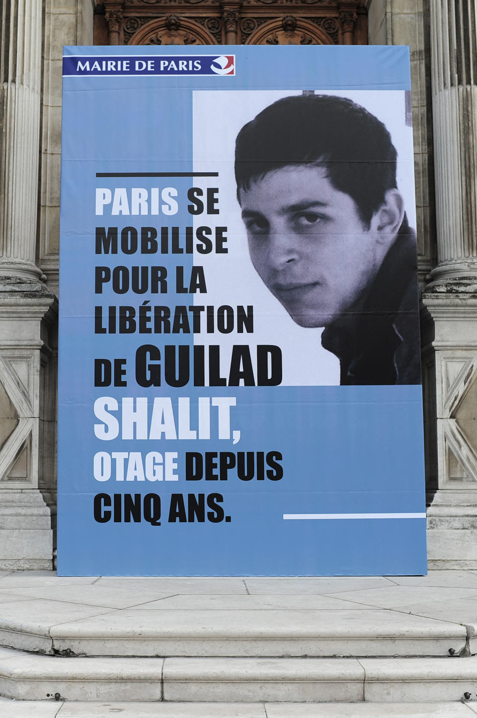 File photo of portrait of Gilad Shalit, a Franco-Israeli soldier captured five years ago, diplayed on the facade at the Paris City Hall
