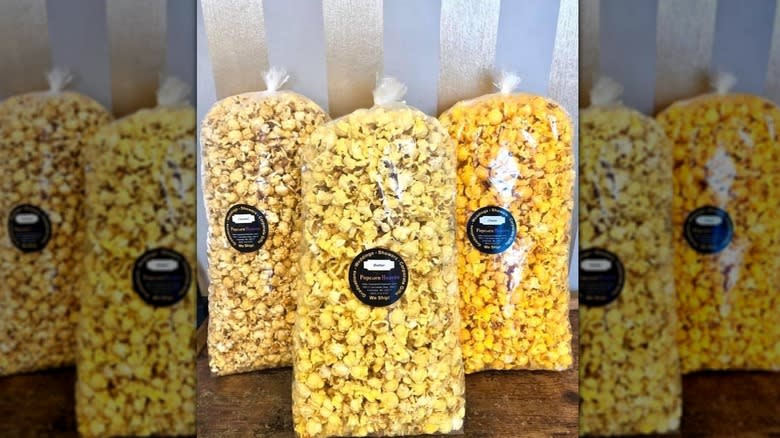 Three bags of Popcorn Heaven's products