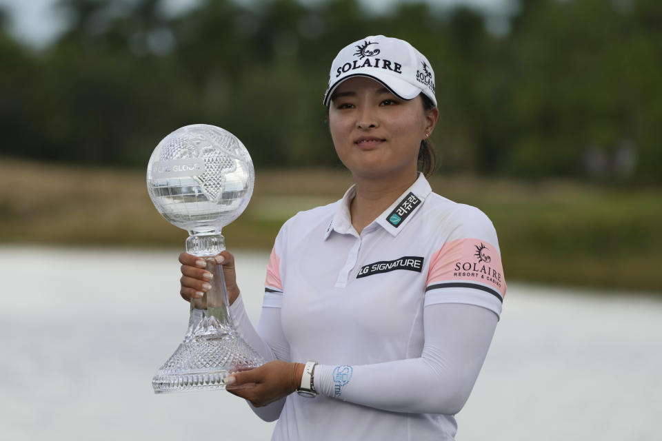 Jin Young Ko, of Korea, holds the winners trophy after winning the LPGA Tour Championship golf tournament, Sunday, Nov. 21, 2021, in Naples, Fla. (AP Photo/Rebecca Blackwell)