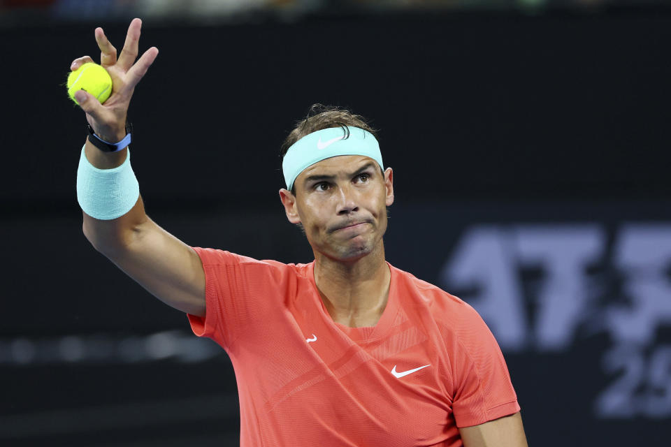 FILE - Rafael Nadal of Spain waves to the crowd in his match against Dominic Thiem of Austria during the Brisbane International tennis tournament in Brisbane, Australia, Tuesday, Jan. 2, 2024. Rafael Nadal pulled out of the BNP Paribas Open on Wednesday night, March 6, 2024, a day before he was supposed to play his first official match in two months. Nadal, a 22-time Grand Slam champion, posted the news on social media, writing that he was announcing the withdrawal “with great sadness.” (AP Photo/Tertius Pickard, File)