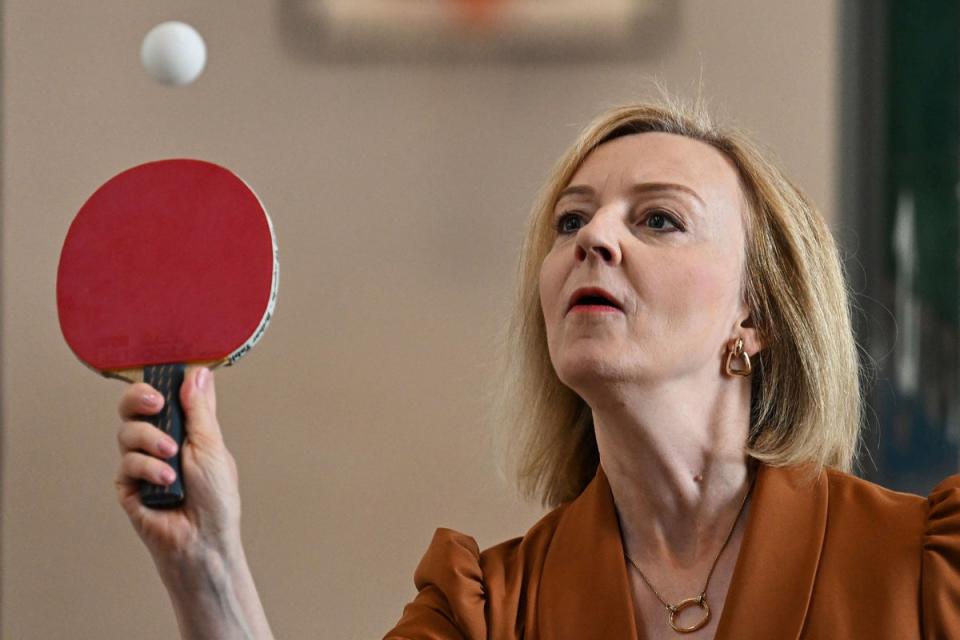 Liz Truss playing table tennis during a visit to the Onside Future Youth Zone in London (PA)