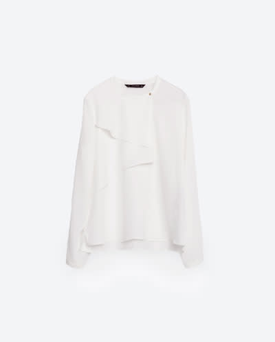 <p>Keep midriffs hidden and stay away from spaghetti straps or strapless items. A long sleeve draped blouse is bound to look smart and effortlessly chic when tucked into a statement skirt. <i><a rel="nofollow noopener" href="http://www.zara.com/uk/en/woman/tops/view-all/blouse-with-frill-and-snap-closure-c719021p3331504.html" target="_blank" data-ylk="slk:[Zara, £25.99];elm:context_link;itc:0;sec:content-canvas" class="link ">[Zara, £25.99]</a></i></p>