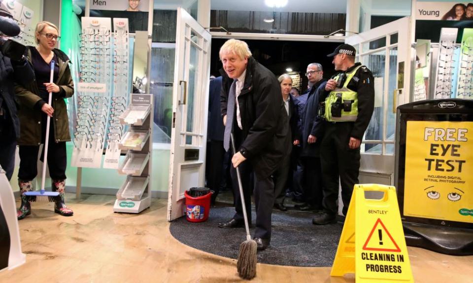 Boris Johnson using mop