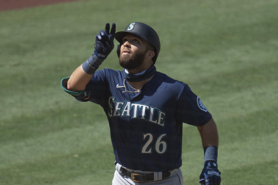 Seattle Mariners' Jose Marmolejos celebrates his solo home run during the sixth inning of a baseball game against the Los Angeles Angels in Anaheim, Calif., Monday, Aug. 31, 2020. (AP Photo/Kyusung Gong)