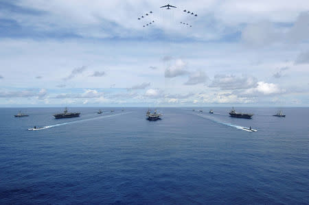 The USS Nimitz, USS Kitty Hawk and USS John C. Stennis Carrier Strike Groups transit in formation during a joint photo exercise during exercise Valiant Shield 2007 in the Pacific Ocean in this August 14, 2007 handout photo. The aerial formation consists of aircraft from the carrier strike groups as well as Air Force aircraft. Mass Communication Specialist Seaman Stephen W. Rowe/U.S. Navy/Handout via REUTERS