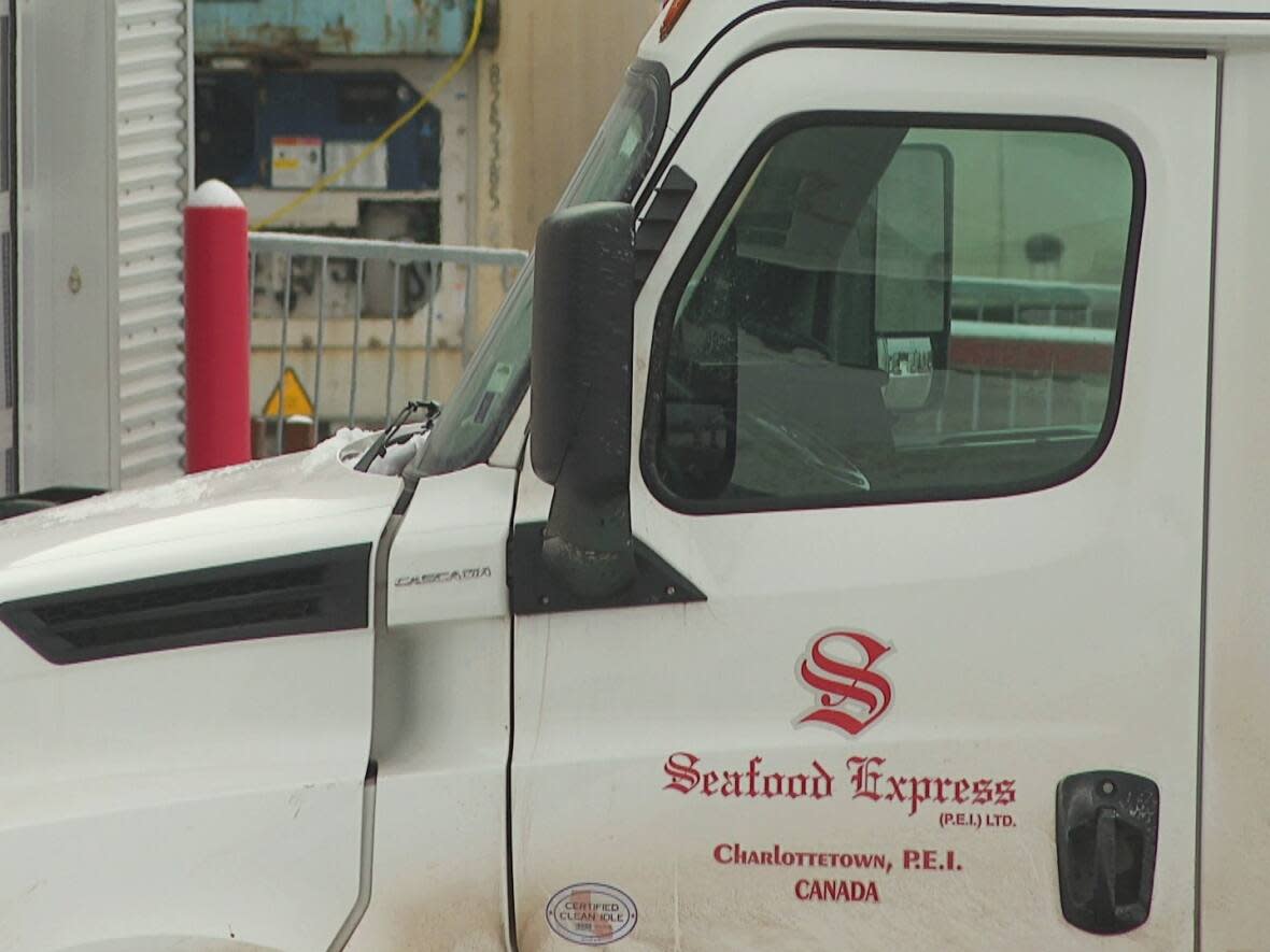 A white envelope was taped to the side of a truck from SFX Transport, formerly known as Seafood Express. (CBC - image credit)