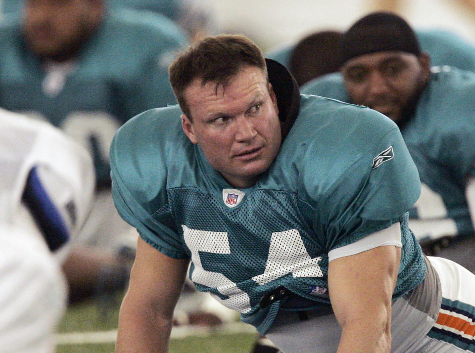 FILE - Miami Dolphins linebacker Zach Thomas stretches during NFL football training camp in Davie, Fla., July 29, 2007. Thomas is among those who were voted into the Pro Football Hall of Fame, it was announced Thursday, Feb. 9, 2023. (AP Photo/J. Pat Carter, File)