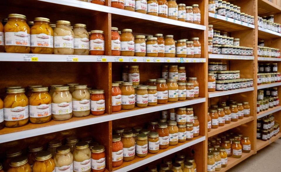 Fruits and sauces in jars line shelves at Sowers Market at 670 Tyrone Pike in Philipsburg.