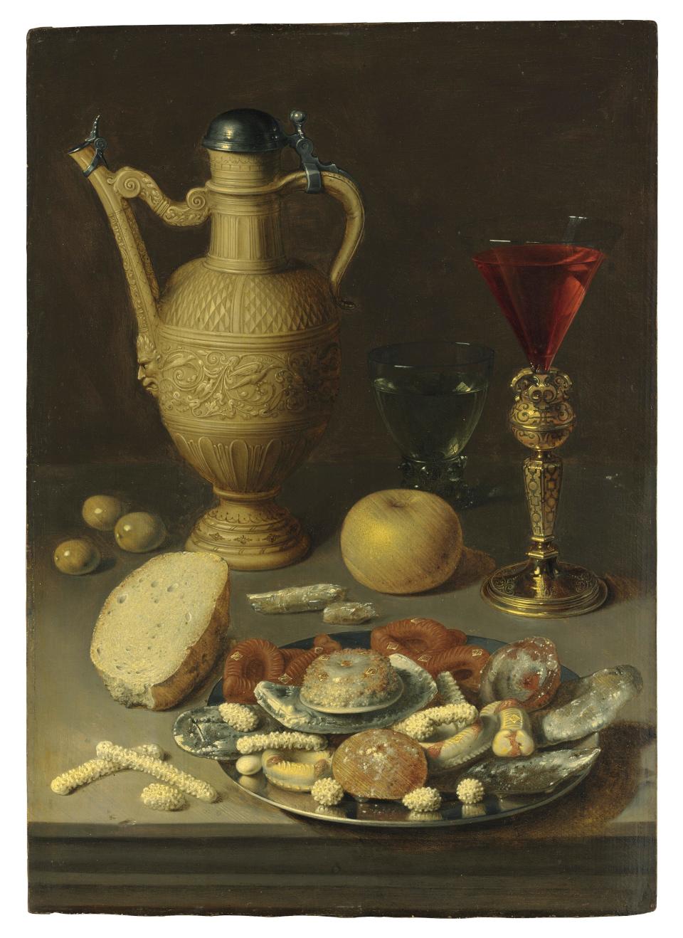 David Rijckaert II (Antwerp 1589-1642) A stoneware ewer, a Berkemeyer and a conical glass in a bekerschroef, with confectionery in a silver platter, on a ledge oil on panel - Credit: Christie's