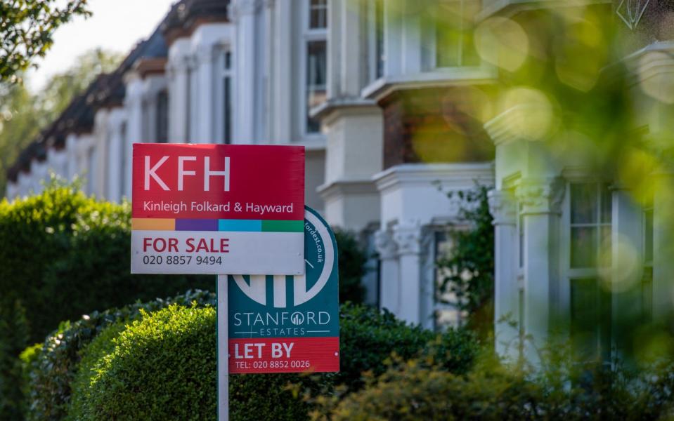 A For sale sign outside a house