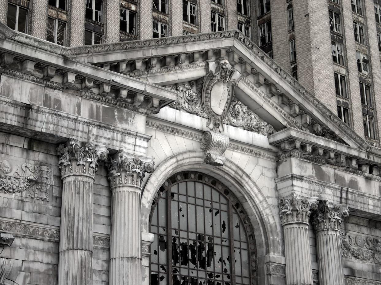 "A close-up view of the abandoned Michigan Central Station in Detroit, Michigan.Some grain and texture for a dark, gritty feel."