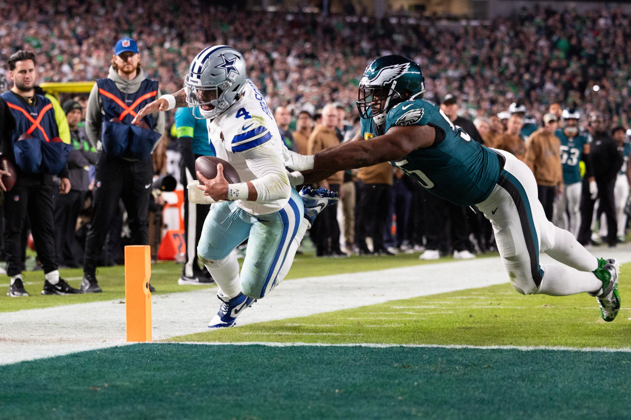 Nov 5, 2023; Philadelphia, Pennsylvania, USA; Philadelphia Eagles defensive end Brandon Graham (55) pushes Dallas Cowboys quarterback Dak Prescott (4) out of bounds short of a two point conversion during the fourth quarter at Lincoln Financial Field. Mandatory Credit: Bill Streicher-USA TODAY Sports