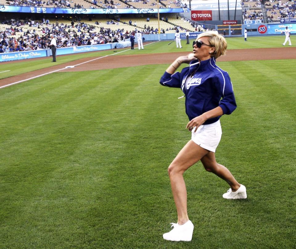 A photograph of Victoria Beckham throwing out the first pitch at the Los Angeles Dodgers vs New York Mets game Monday, June 11, 2007 at Dodger Stadium in Los Angeles,California.