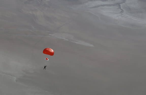 SpaceShipTwo pilot Peter Siebold parachutes to Earth after the space plane broke apart during a test flight on Oct. 31, 2014, killing copilot Michael Alsbury.