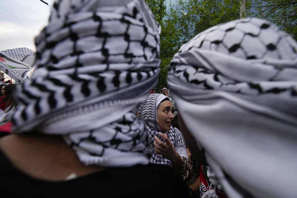 Members of the Palestinian community participate in a protest to support the Palestinian people amid the ongoing Isreal-Hamas war, in front of the Israeli embassy in Santiago, Chile, Thursday, Oct. 19, 2023. (AP Photo/Esteban Felix)