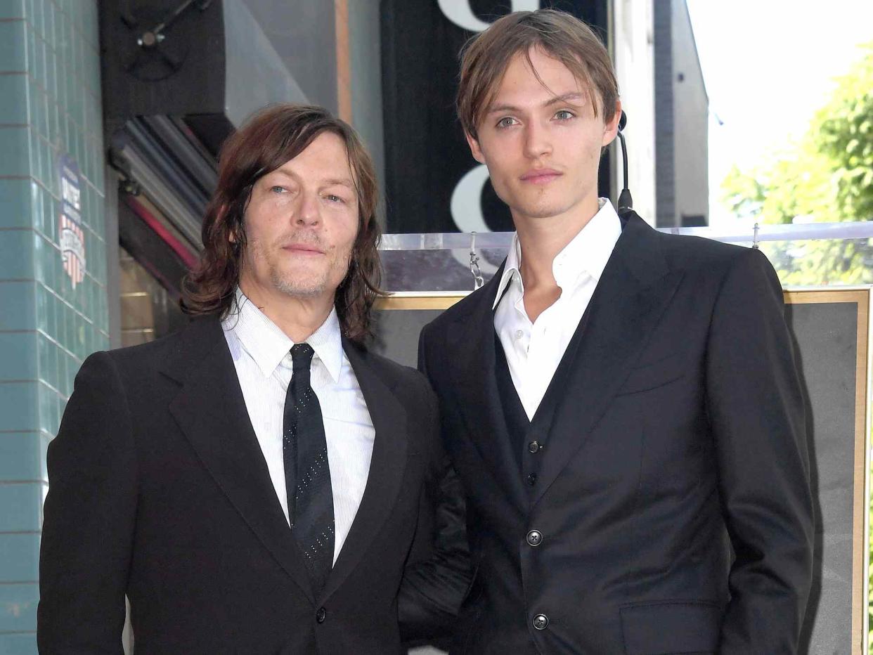 <p>Albert L. Ortega/Getty</p> Norman Reedus poses with his son Mingus Lucien Reedus at his Star Ceremony on the Hollywood Walk of Fame in 2022