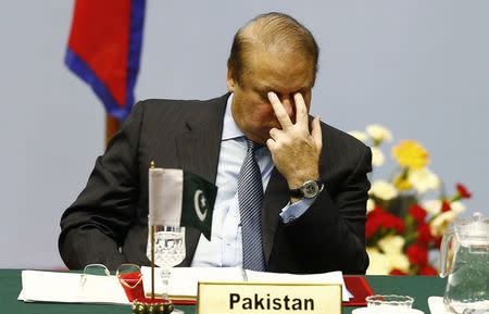 Pakistani Prime Minister Nawaz Sharif reacts as he attends the opening session of 18th South Asian Association for Regional Cooperation (SAARC) summit in Kathmandu November 26, 2014. REUTERS/Narendra Shrestha/Pool