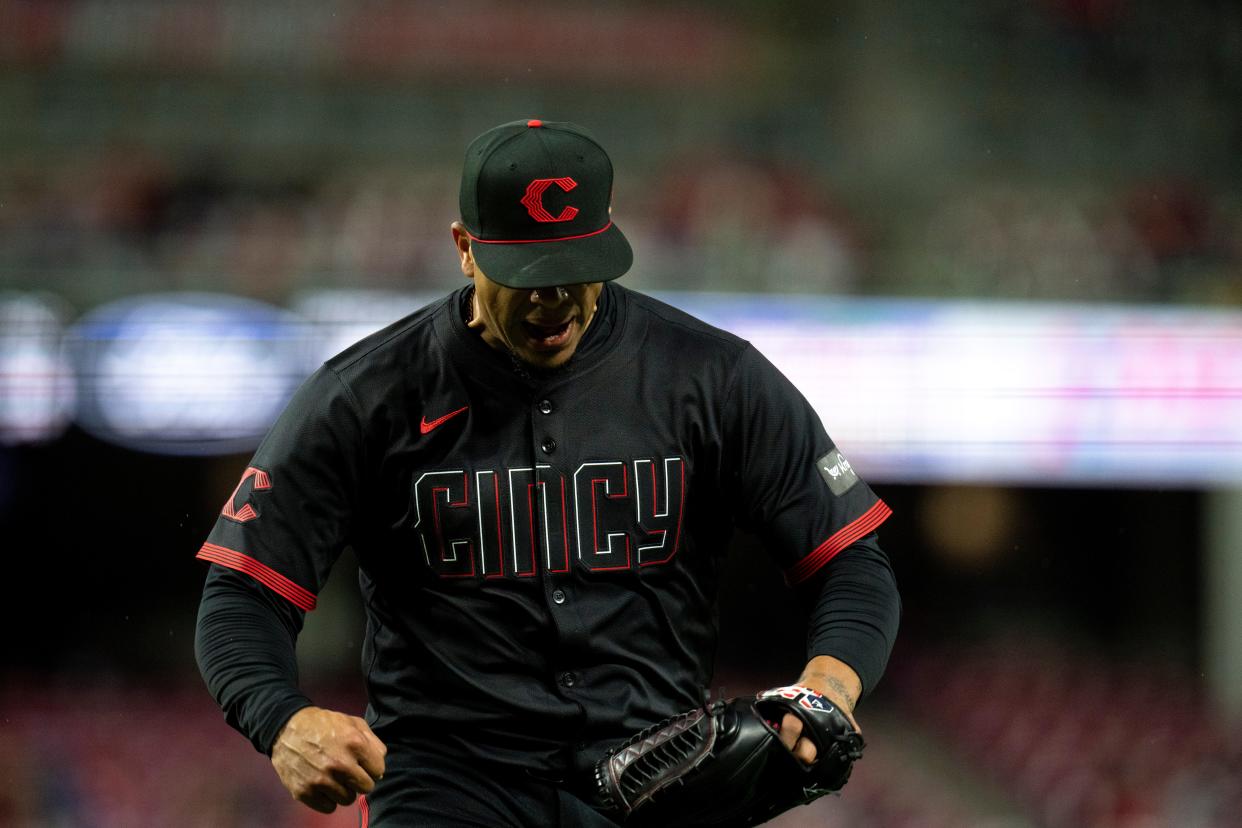 Fernando Cruz reacts earlier this season after getting out of a seventh-inning jam, something he has excelled at for the Reds this season. “I love to be in those situations,” he said. “I’d welcome 100 more of them.”