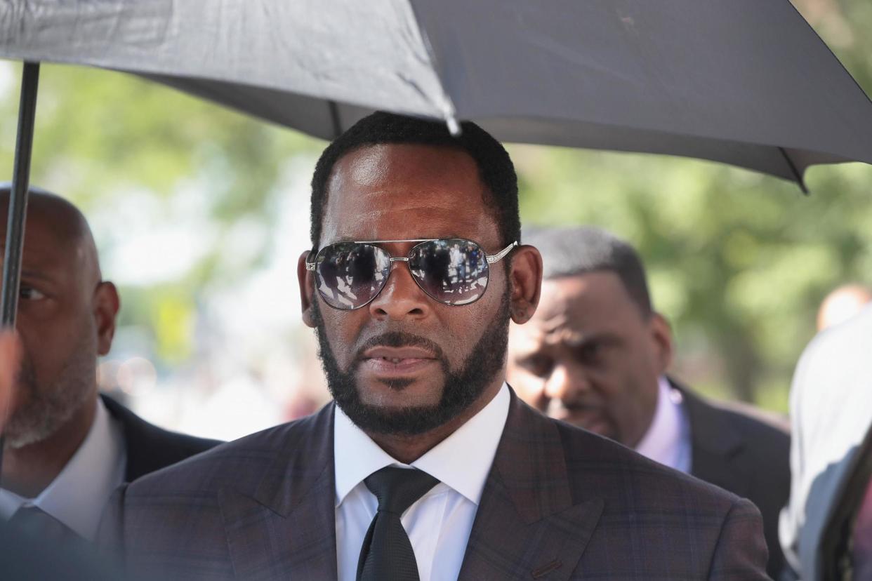 R. Kelly leaves a court hearing in Chicago. The embattled singer's trial is finally approaching. (Scott Olson/Getty Images)